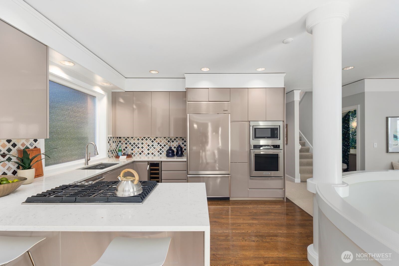 1717 Ferry Avenue Southwest Seattle, WA 98116 - Photo 12 of 37 a kitchen with stainless steel appliances granite countertop a sink and a refrigerator