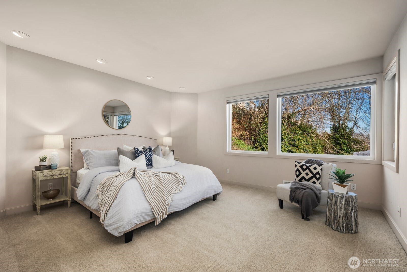 1717 Ferry Avenue Southwest Seattle, WA 98116 - Photo 17 of 37 a bedroom with bed and a large window