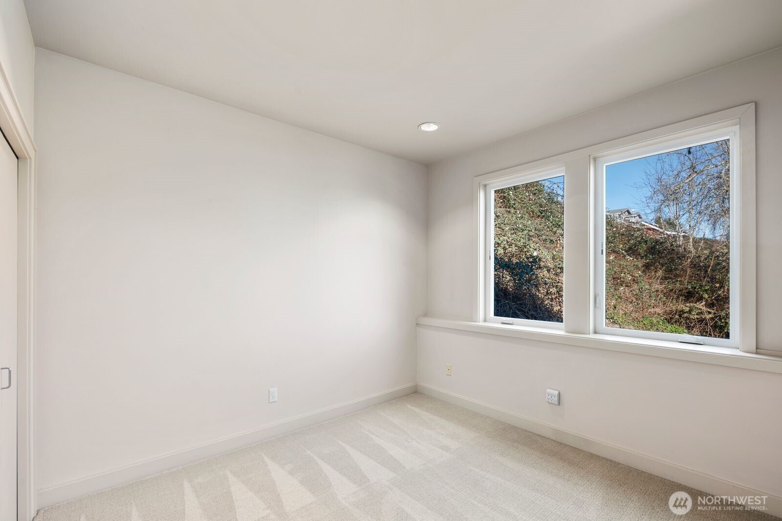 1717 Ferry Avenue Southwest Seattle, WA 98116 - Photo 26 of 37 an empty room with a window