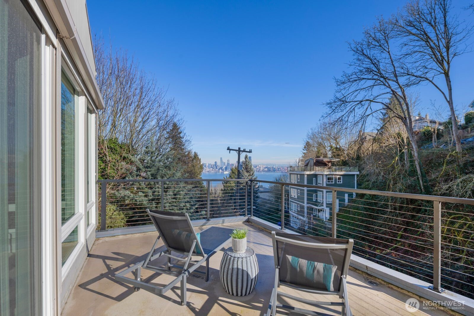 1717 Ferry Avenue Southwest Seattle, WA 98116 - Photo 29 of 37 a view of a chair and tables in the balcony