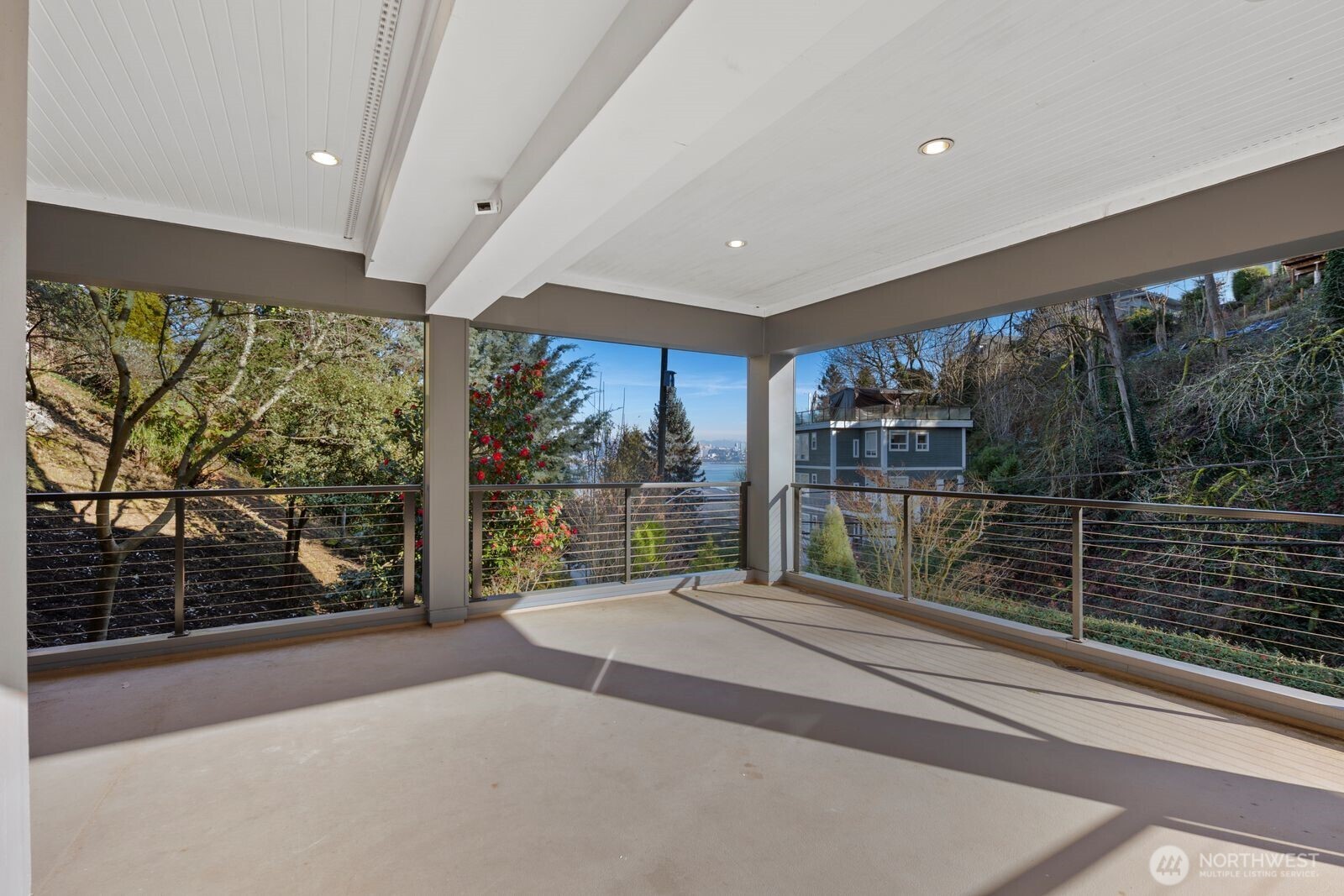 1717 Ferry Avenue Southwest Seattle, WA 98116 - Photo 30 of 37 a large window with swimming pool in front of the house