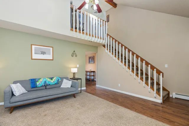 a view of livingroom with furniture and stairs