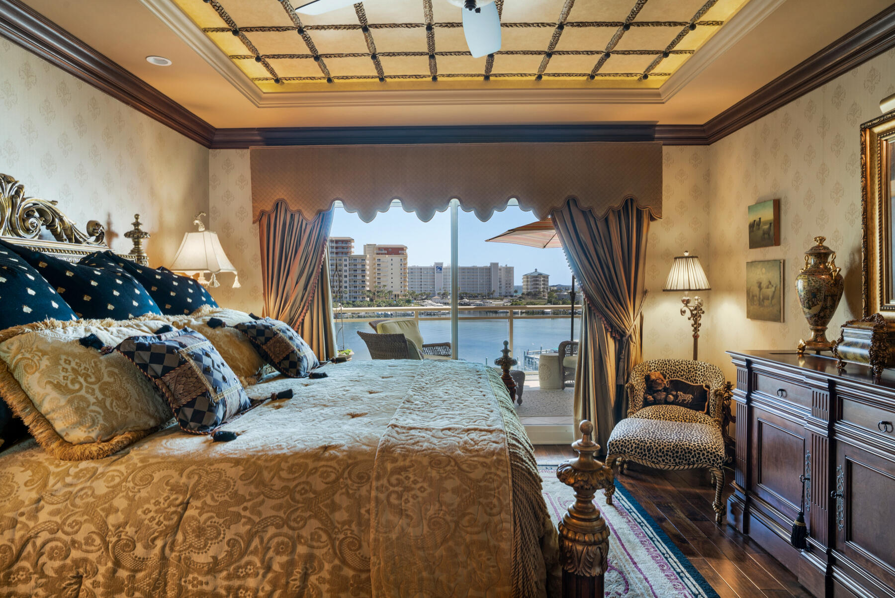 770 Harbor Boulevard, Unit 3E Destin, FL 32541 - Photo 15 of 44 a bed sitting in a bedroom next to a window