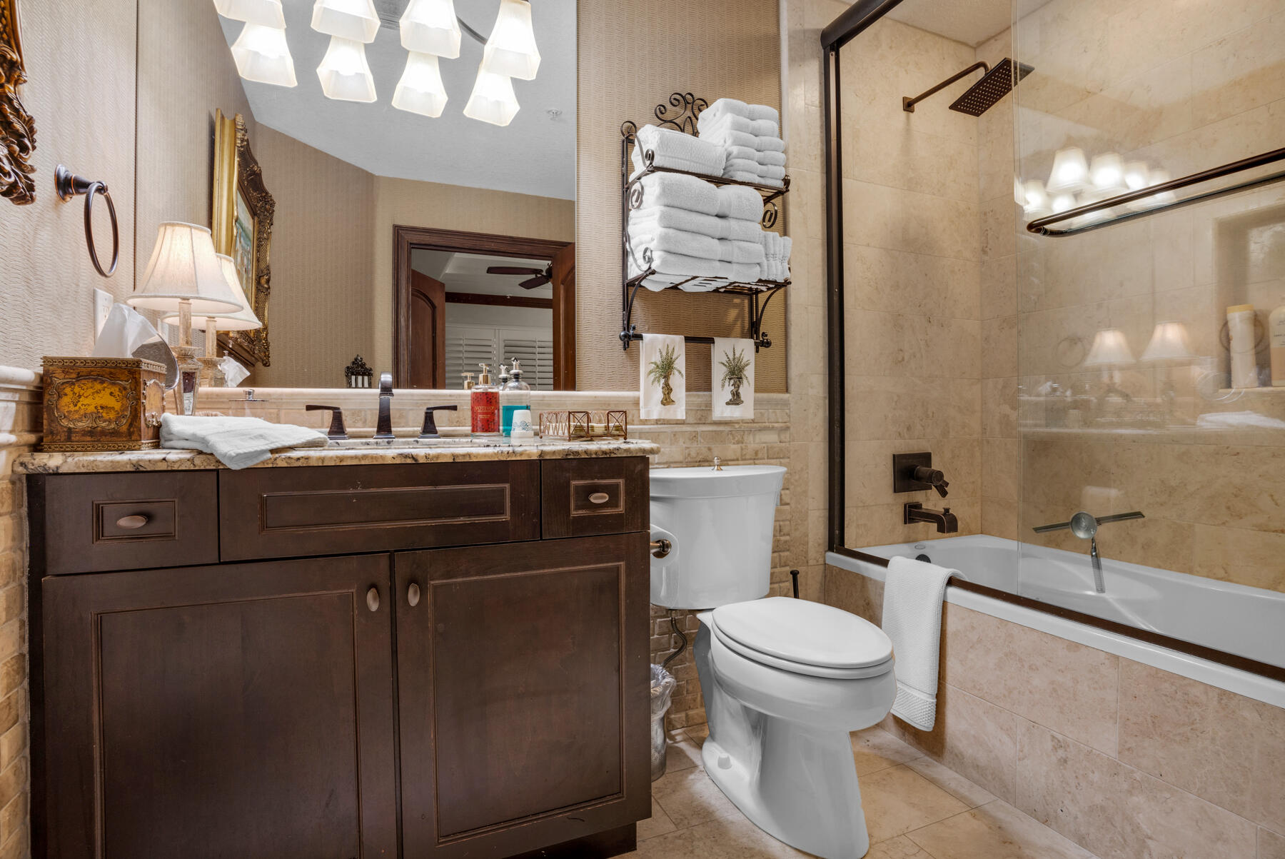770 Harbor Boulevard, Unit 3E Destin, FL 32541 - Photo 23 of 44 a bathroom with a sink a toilet and mirror