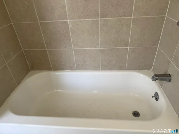 a bathroom with a bath tub