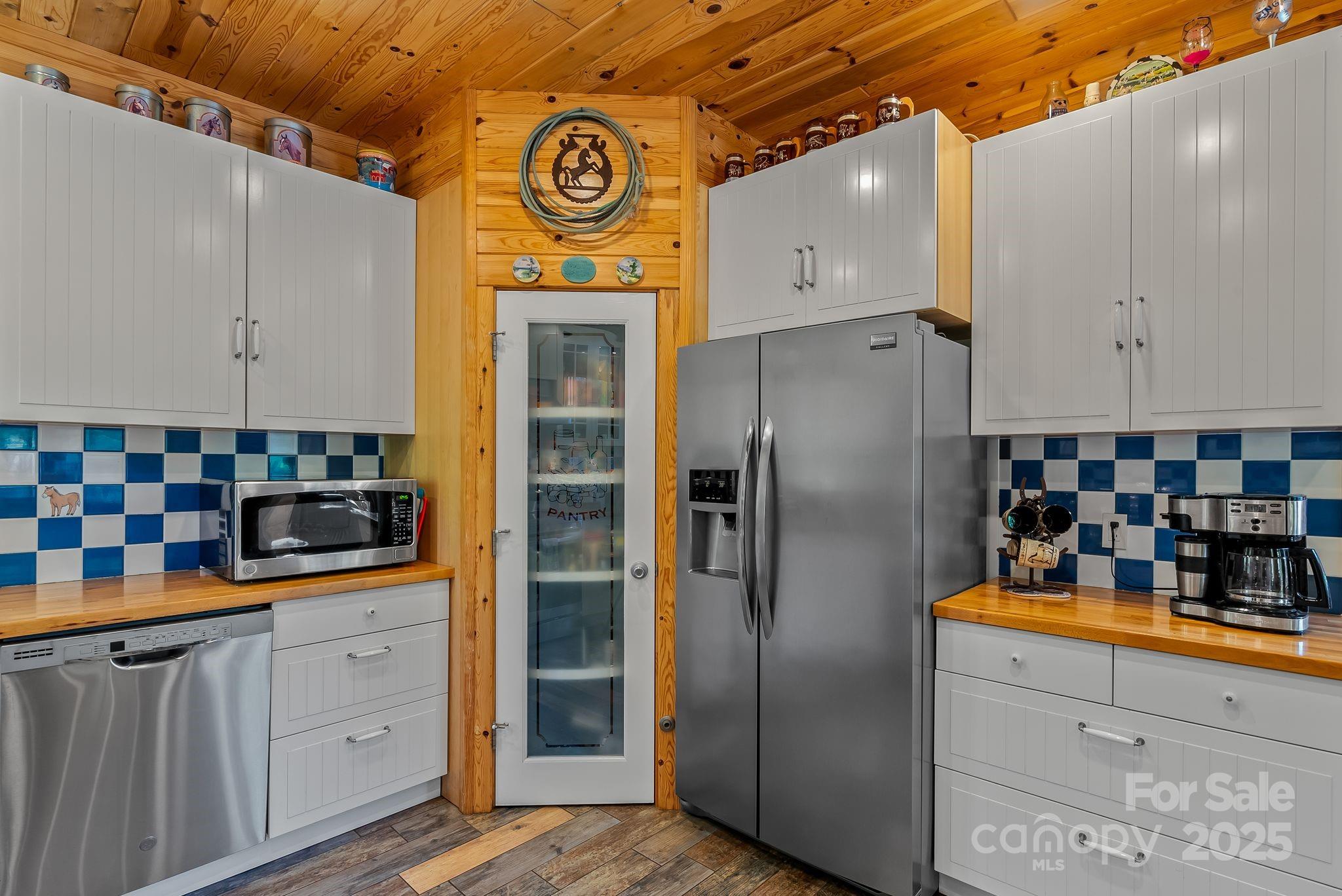 1104 Long Br Road Marshall, NC 28753 - Photo 14 of 45 a kitchen with stainless steel appliances granite countertop a refrigerator and a stove