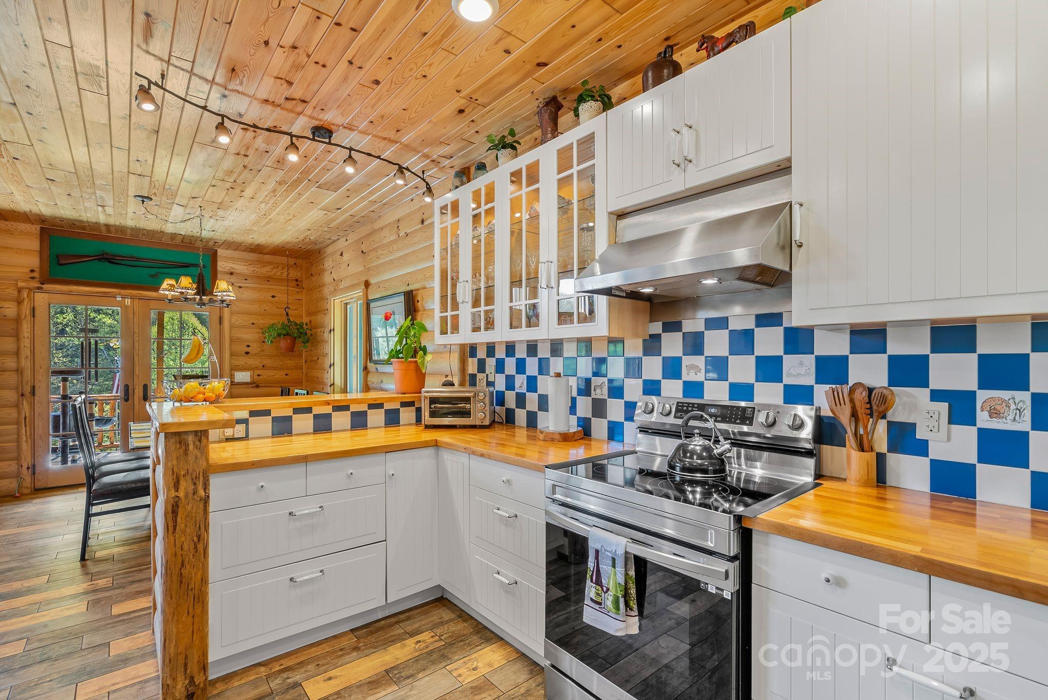 1104 Long Br Road Marshall, NC 28753 - Photo 15 of 45 a kitchen with a stove and cabinets