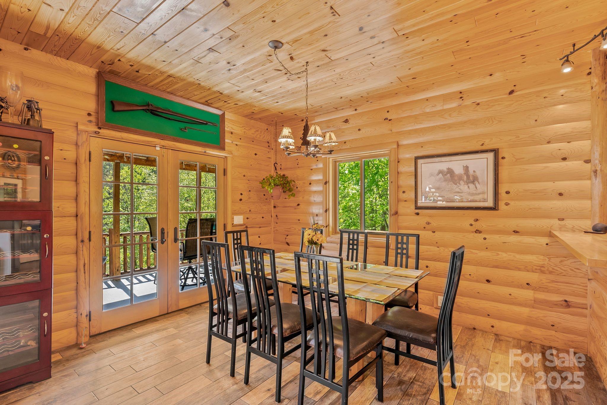 1104 Long Br Road Marshall, NC 28753 - Photo 16 of 45 a view of a dining room with furniture window and wooden floor