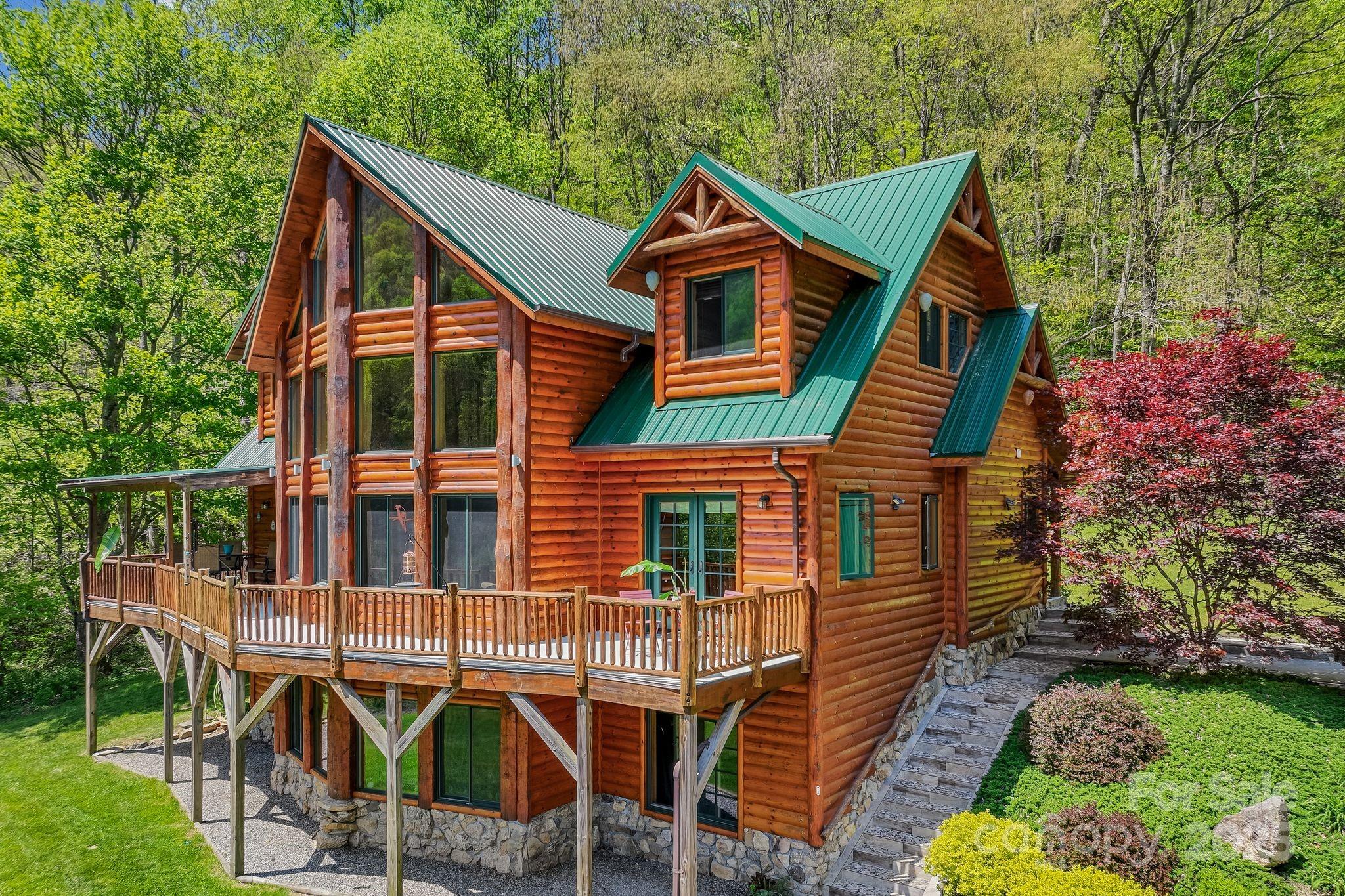 1104 Long Br Road Marshall, NC 28753 - Photo 2 of 45 a front view of a house with garden