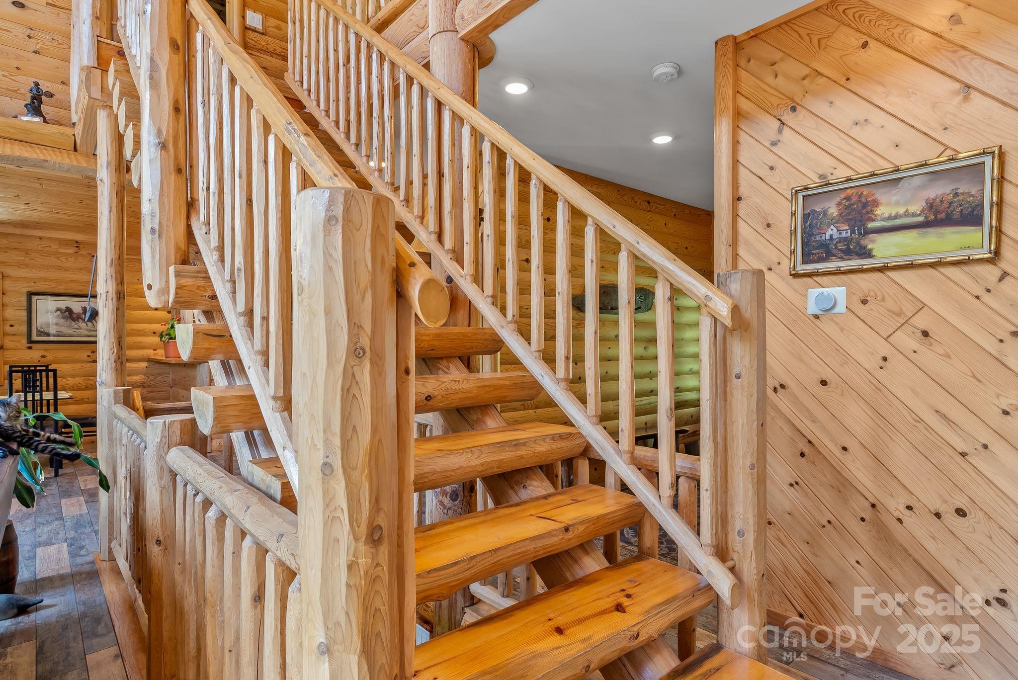1104 Long Br Road Marshall, NC 28753 - Photo 24 of 45 a view of staircase with wooden floor and white walls
