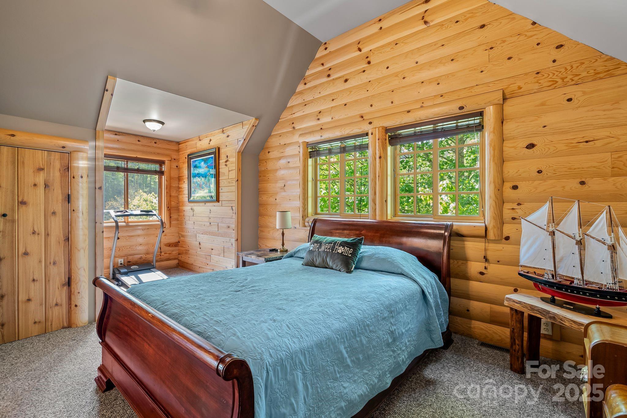 1104 Long Br Road Marshall, NC 28753 - Photo 27 of 45 a bedroom with a bed and wooden floor