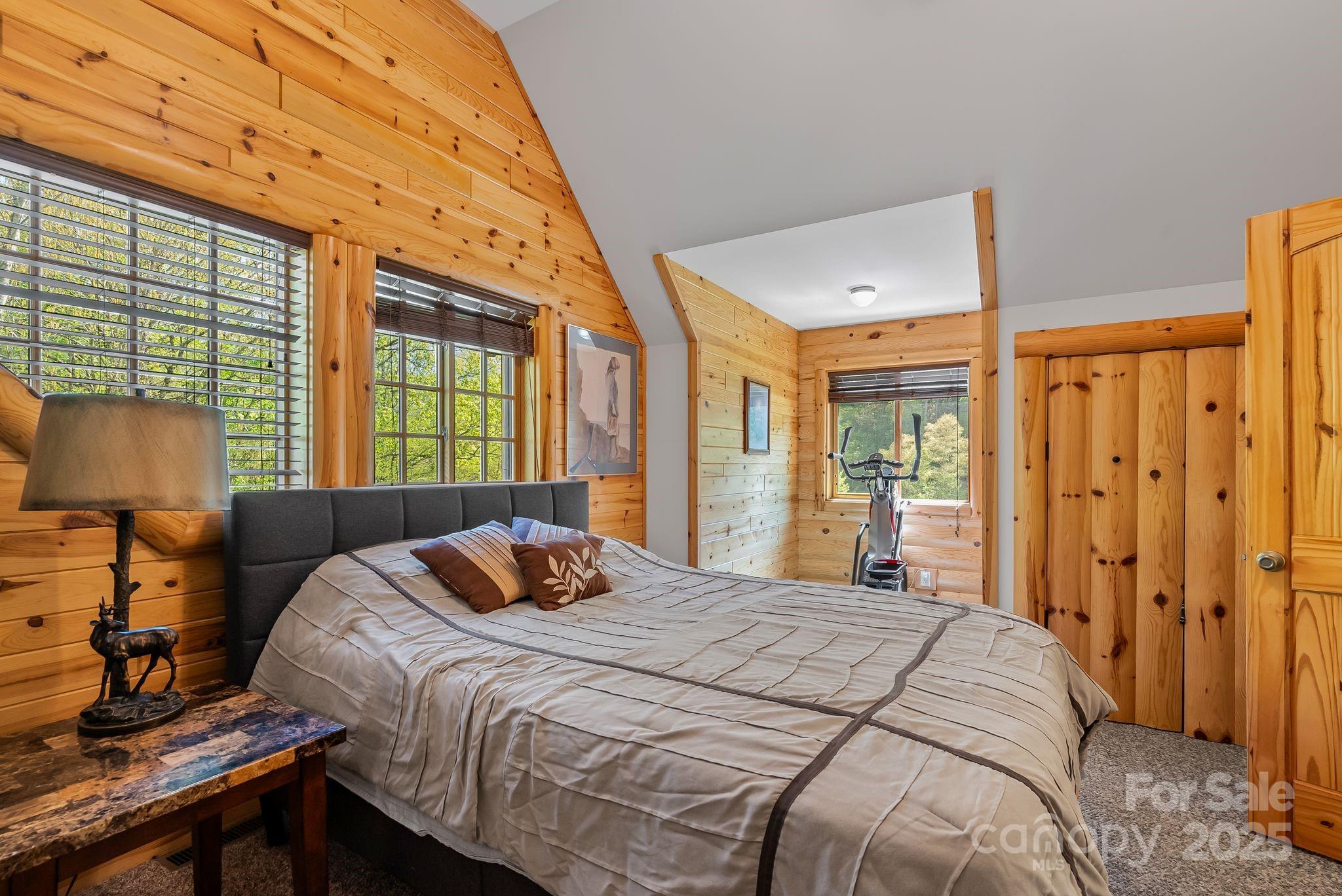 1104 Long Br Road Marshall, NC 28753 - Photo 29 of 45 a bedroom with a bed and a window