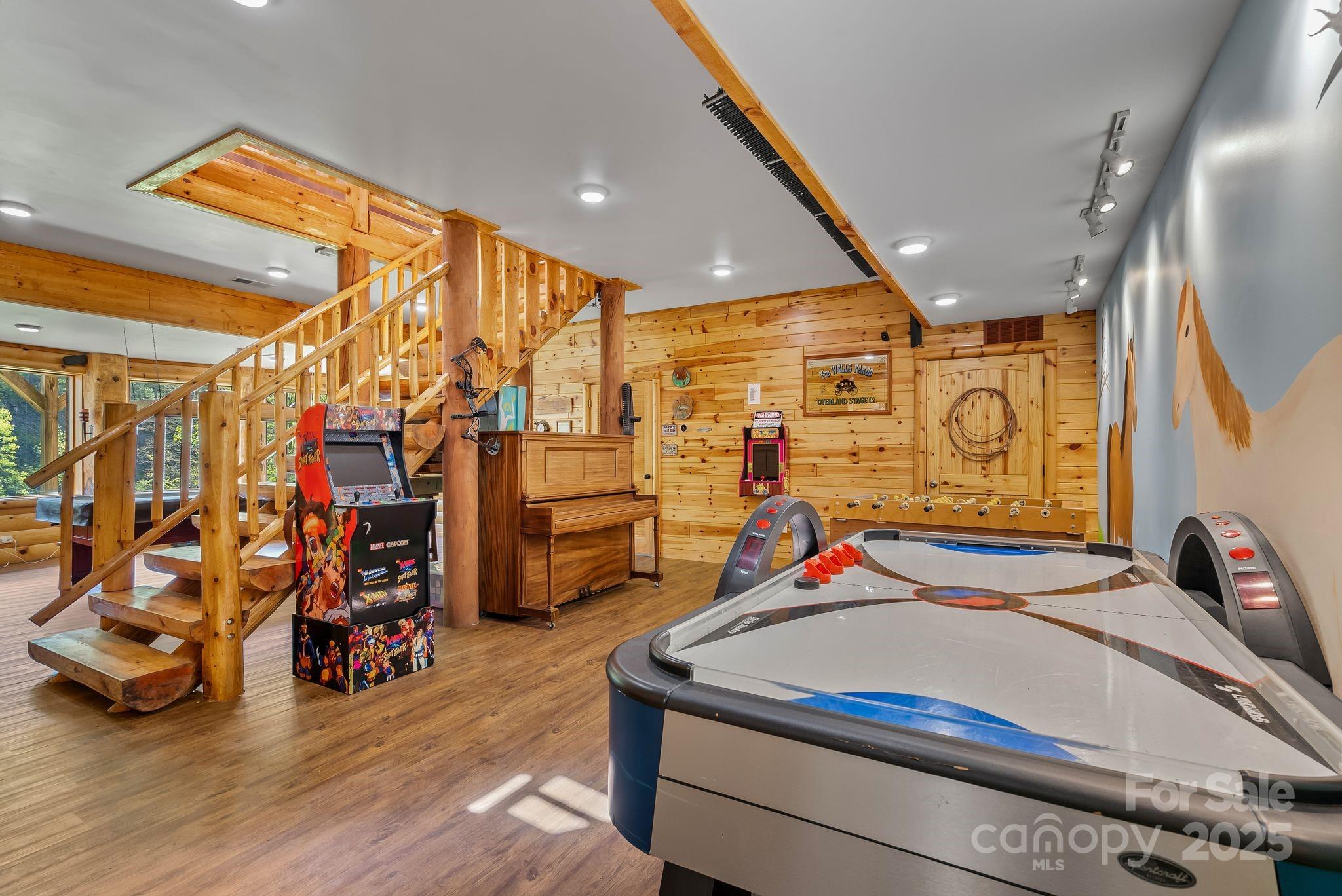 1104 Long Br Road Marshall, NC 28753 - Photo 32 of 45 a bedroom with a bed and a walk in closet