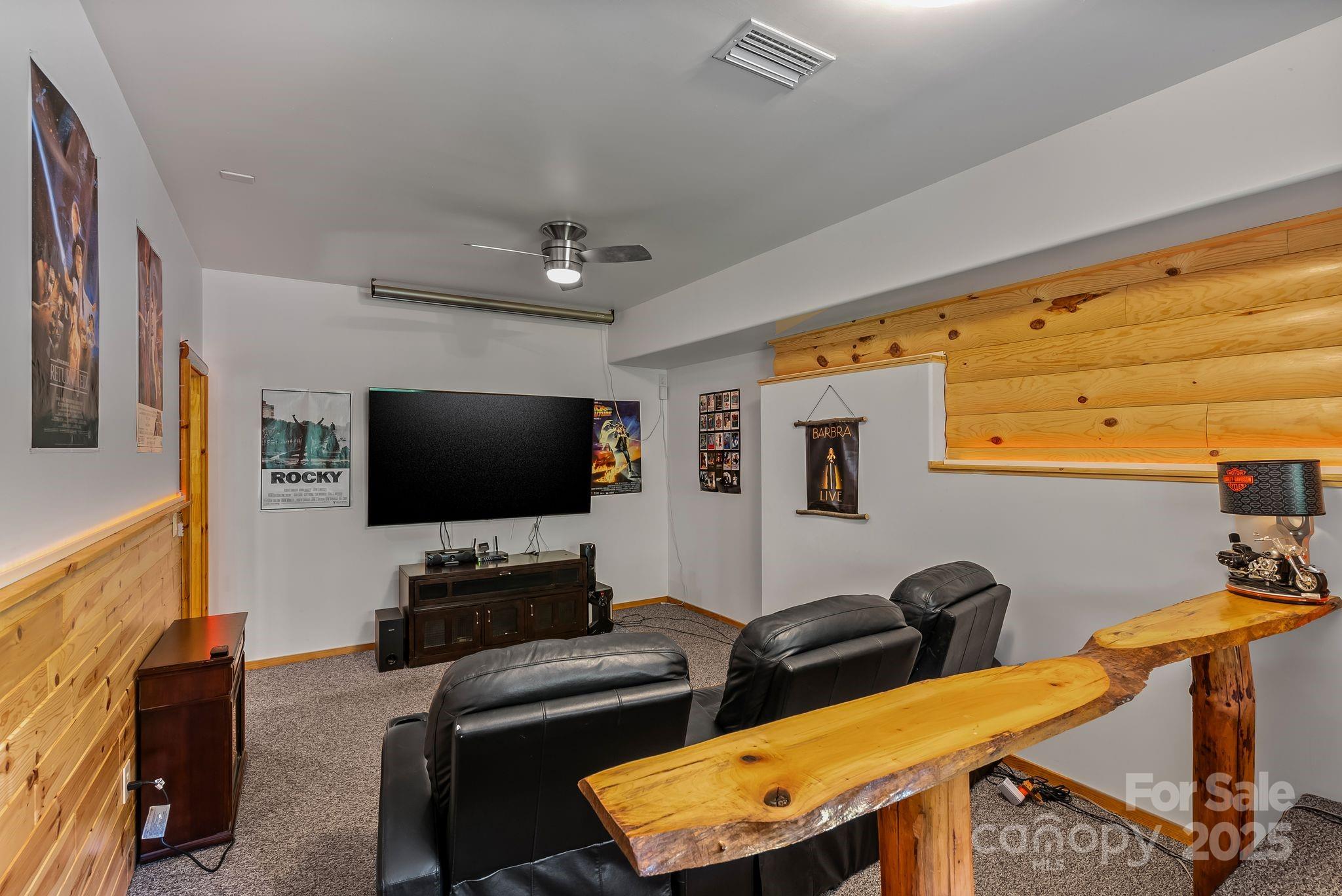 1104 Long Br Road Marshall, NC 28753 - Photo 34 of 45 a bedroom with furniture and a flat screen tv