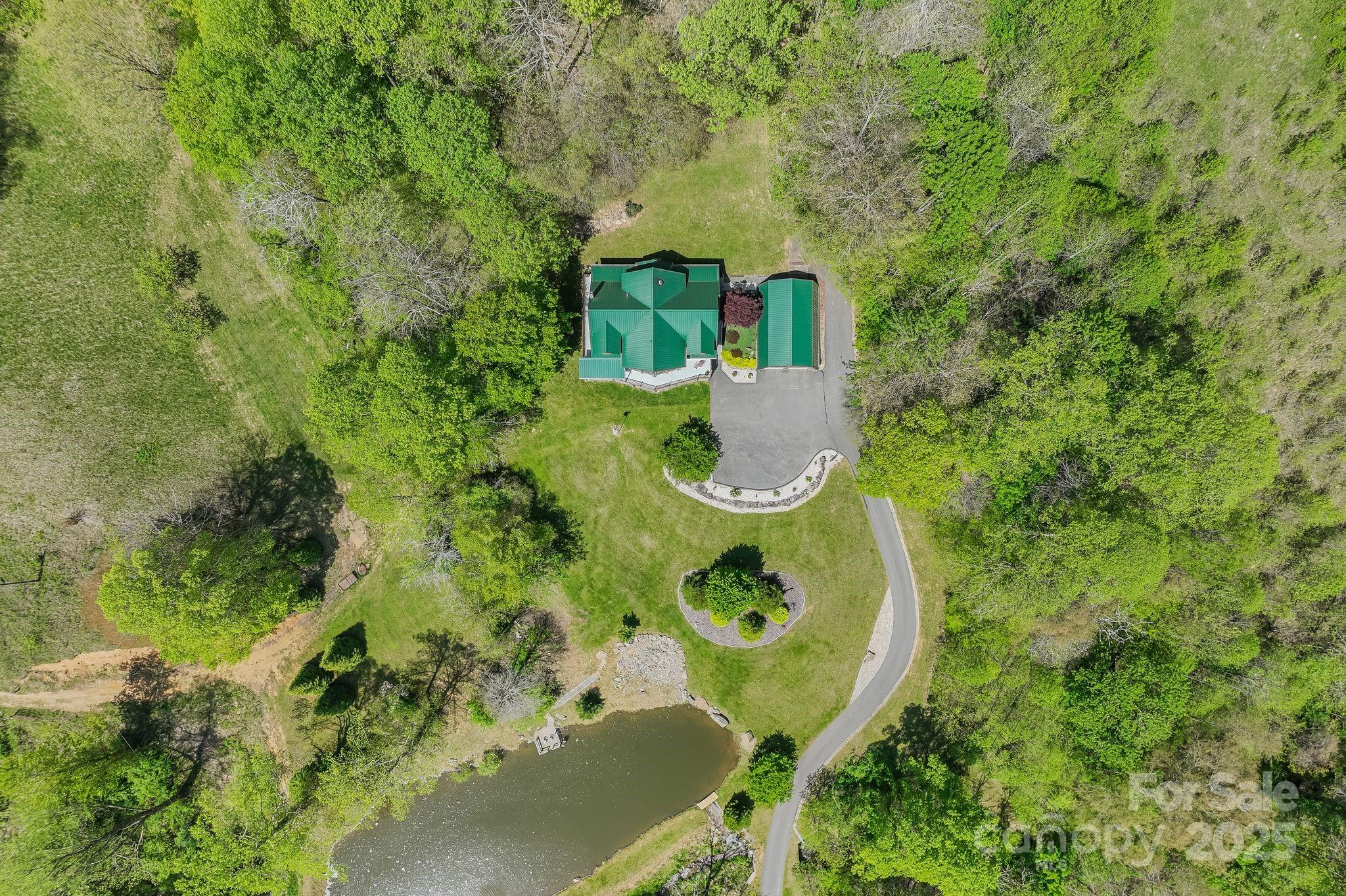 1104 Long Br Road Marshall, NC 28753 - Photo 44 of 45 a view of a house with a backyard and swimming pool