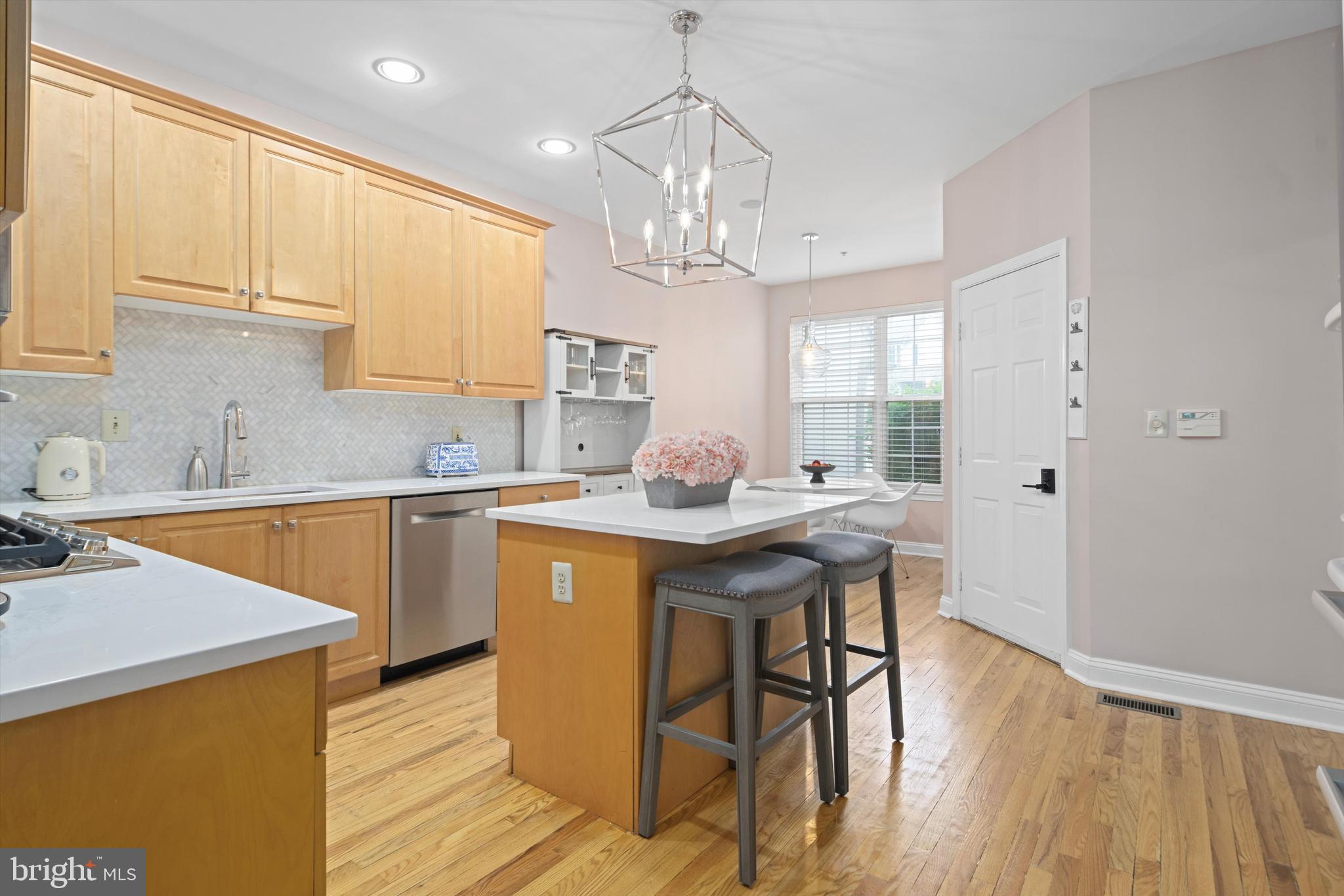 1149 Brian's Way Wayne, PA 19087 - Photo 11 of 37 a kitchen with stainless steel appliances granite countertop a sink stove and refrigerator