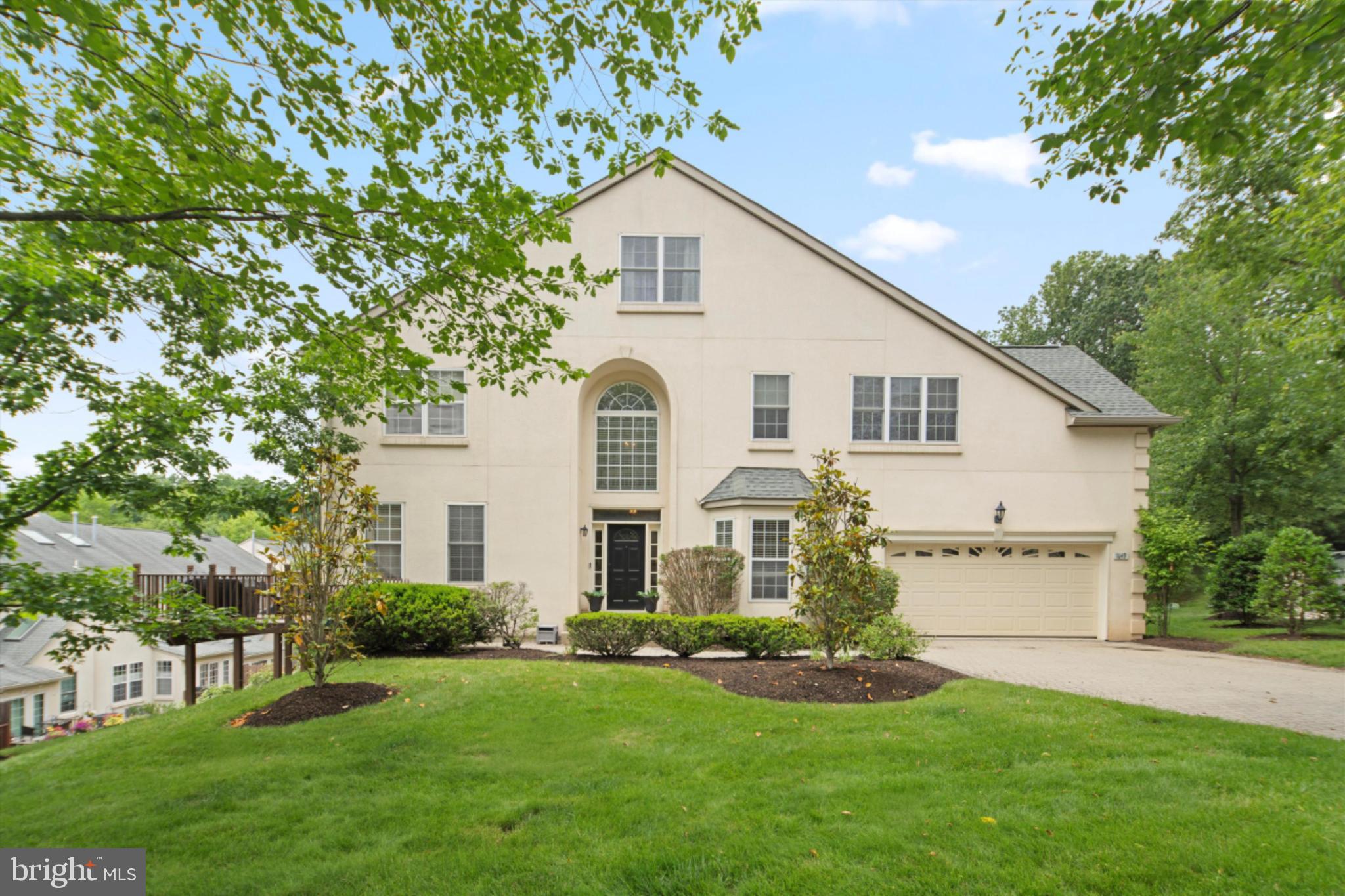1149 Brian's Way Wayne, PA 19087 - Photo 2 of 37 a front view of a house with a garden and yard
