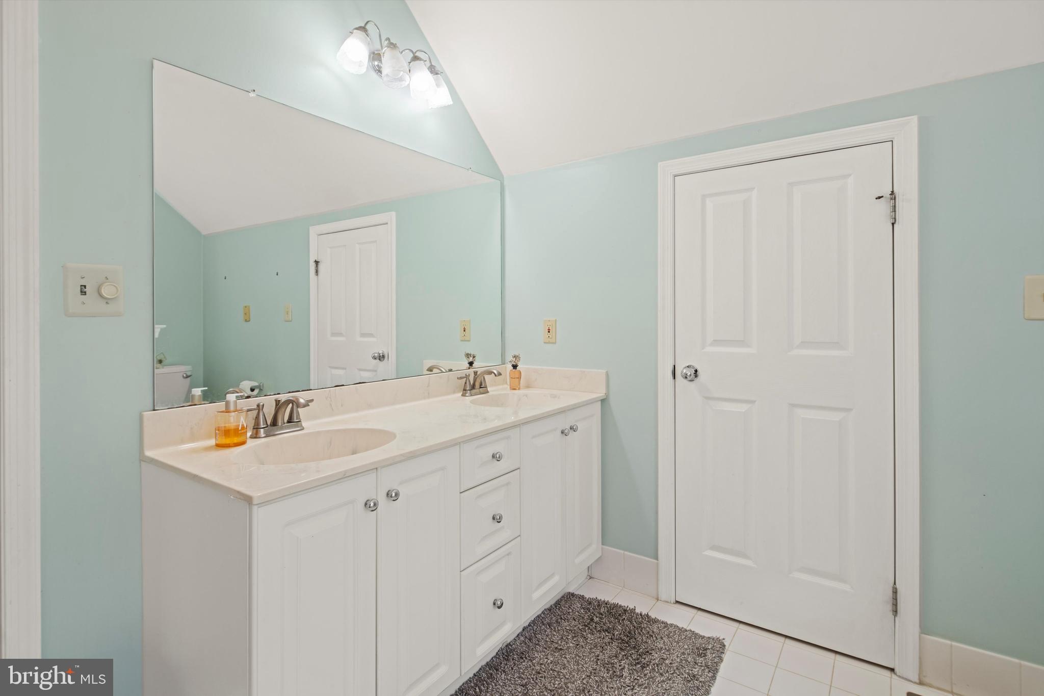 1149 Brian's Way Wayne, PA 19087 - Photo 22 of 37 a spacious bathroom with a double vanity sink and a mirror