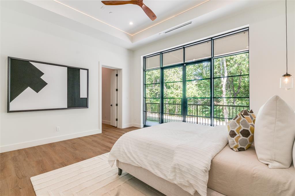 823 West Danieldale Road Duncanville, TX 75137 - Photo 21 of 36 a bed sitting in a bedroom next to a window