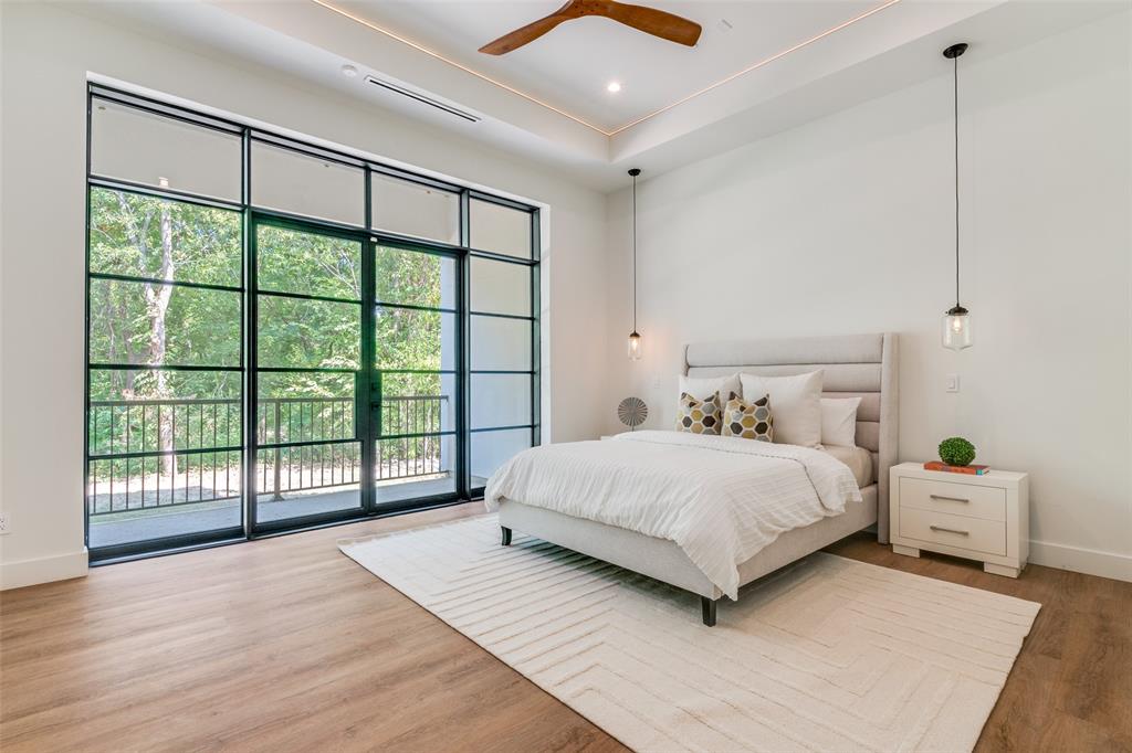 823 West Danieldale Road Duncanville, TX 75137 - Photo 22 of 36 a bedroom with a large bed and a large window