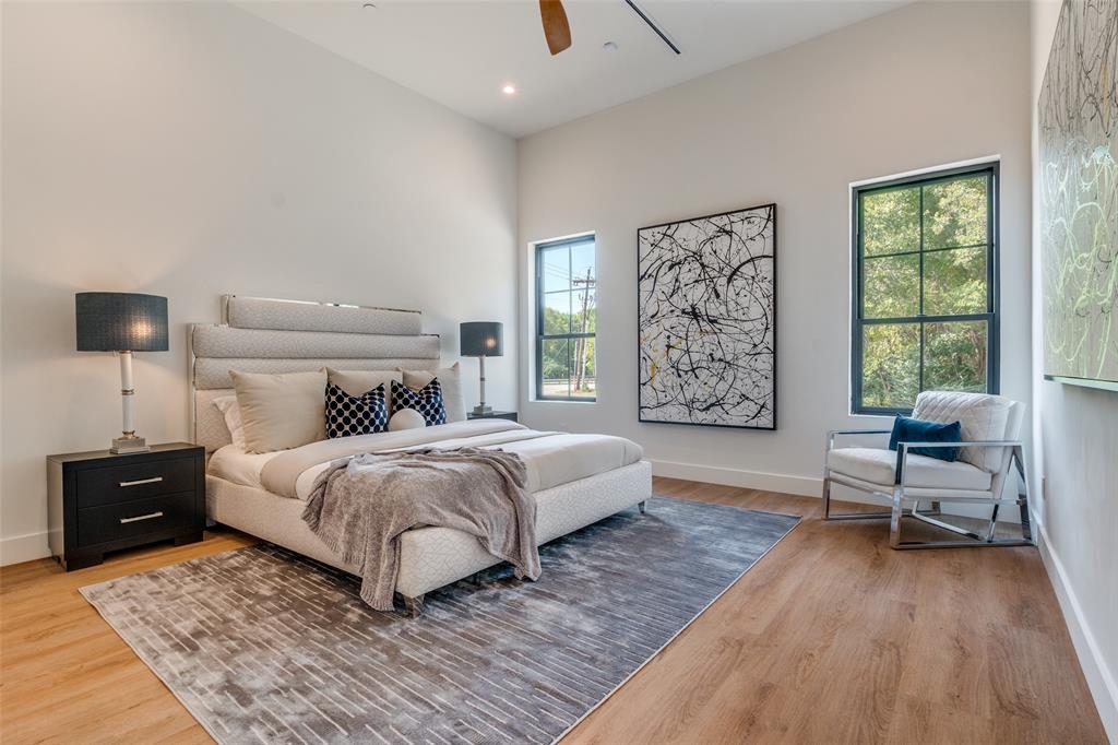 823 West Danieldale Road Duncanville, TX 75137 - Photo 24 of 36 a bedroom with a bed and wooden floor