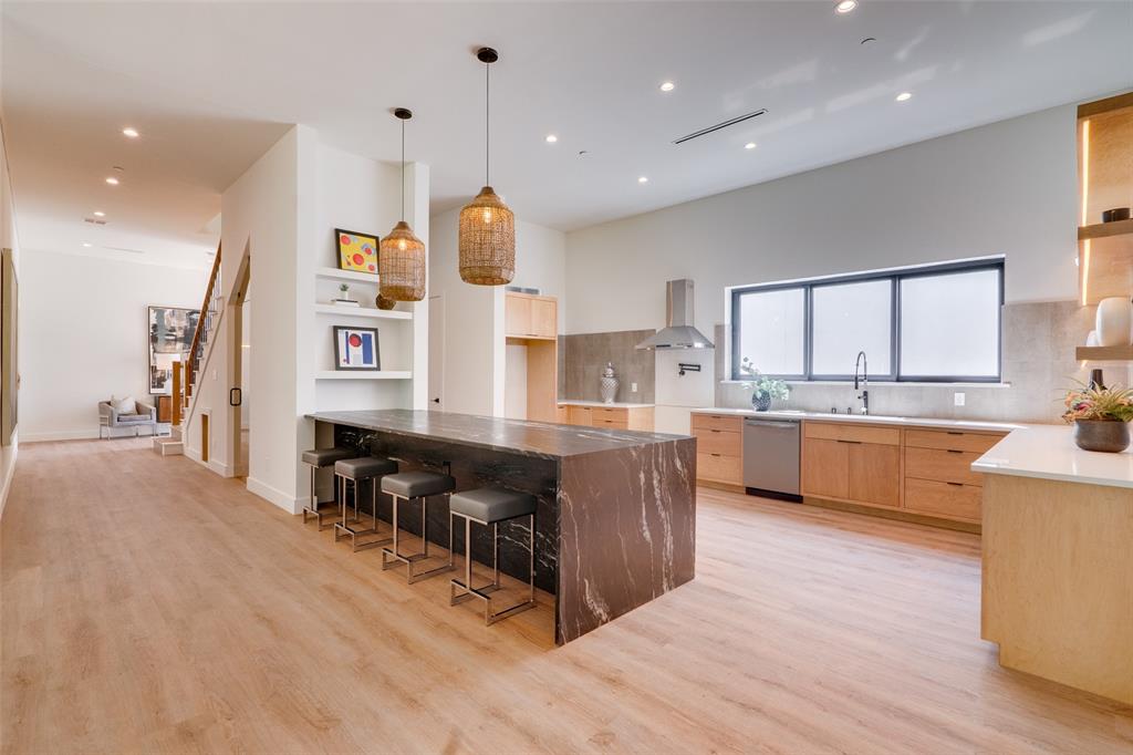 823 West Danieldale Road Duncanville, TX 75137 - Photo 5 of 36 a large kitchen with stainless steel appliances kitchen island granite countertop a large counter top and view of living room