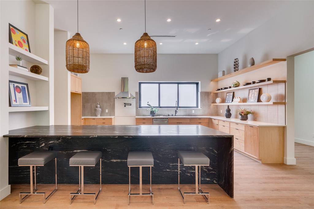 823 West Danieldale Road Duncanville, TX 75137 - Photo 6 of 36 a kitchen with cabinets and chairs in it