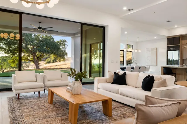 a close view of a stove a sink and dishwasher with wooden floor