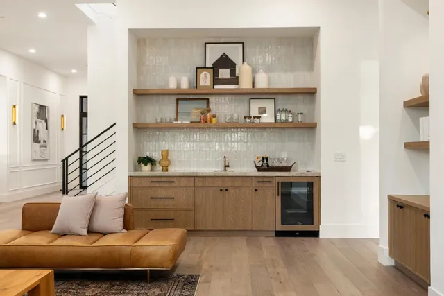 a living room with furniture and large window