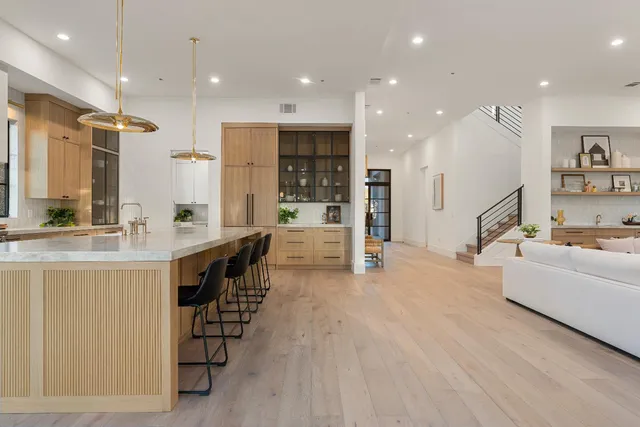 a view of a room with a large window and table