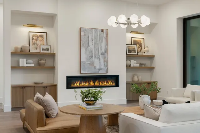 a view of living room with furniture and wooden floor