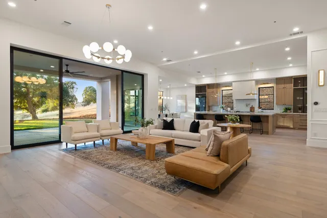 a bathroom with a double vanity sink toilet mirror and bathtub