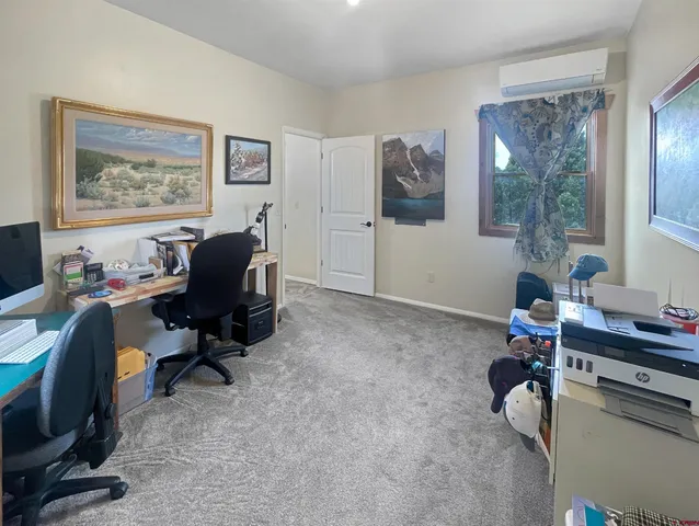 a work room with furniture and a window