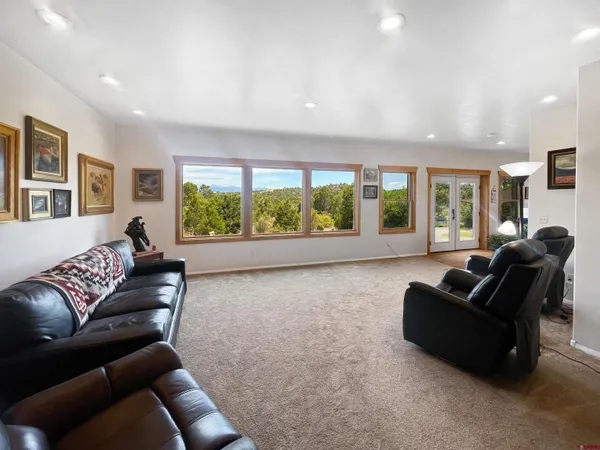 a bedroom with a bed and mirror