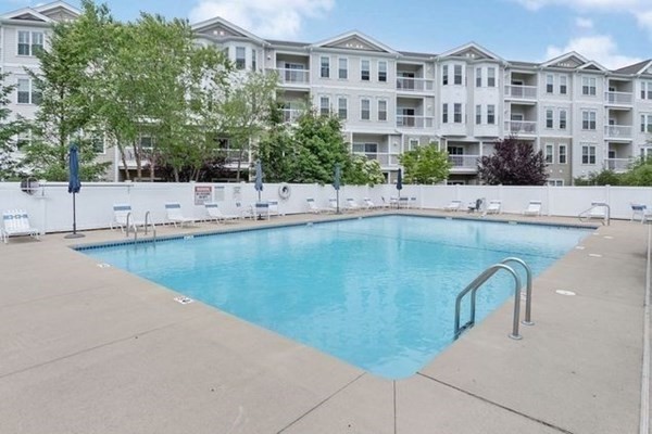 107 Clocktower Drive, Unit 107 Waltham, MA 02452 - Photo 11 of 13 a view of building with swimming pool