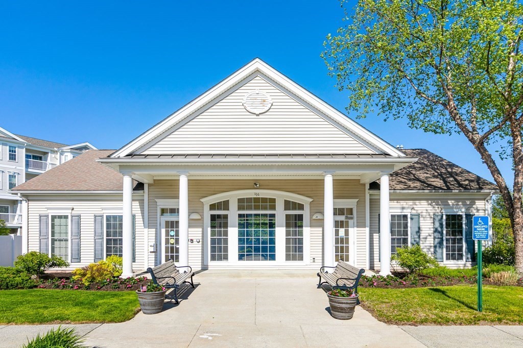 107 Clocktower Drive, Unit 107 Waltham, MA 02452 - Photo 10 of 13 a front view of a house with a yard