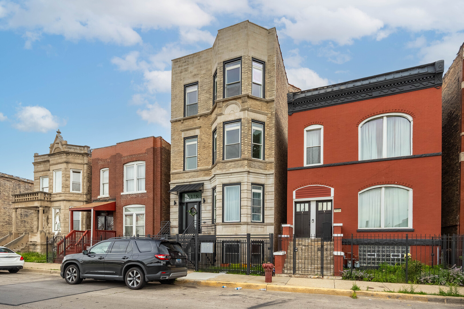 3328 West Congress Parkway, Unit G Chicago, IL 60624 - Photo 1 of 12 a car parked in front of a building