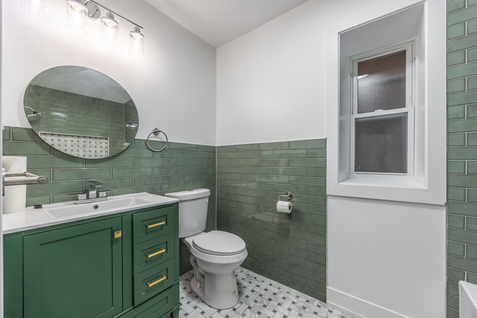 3328 West Congress Parkway, Unit G Chicago, IL 60624 - Photo 12 of 12 a bathroom with a toilet sink vanity and mirror