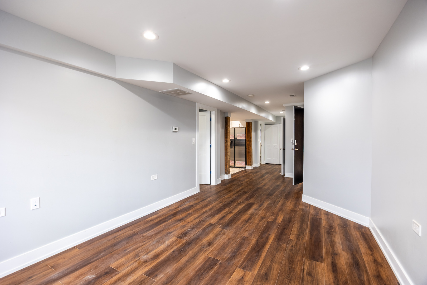 3328 West Congress Parkway, Unit G Chicago, IL 60624 - Photo 7 of 12 a view of hallway with a large window and wooden floor