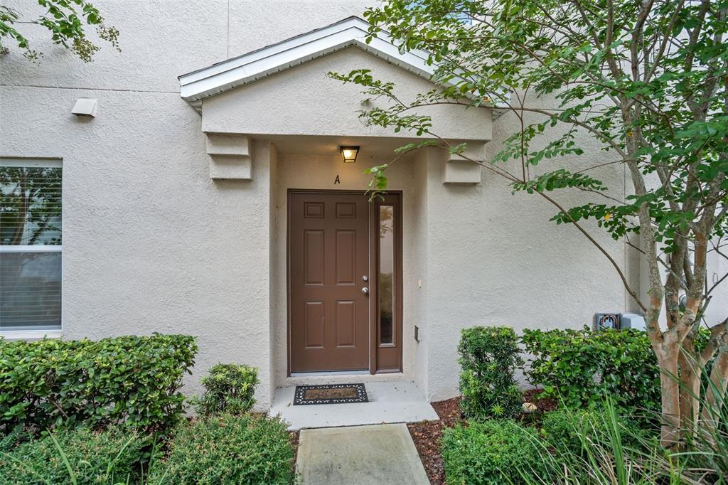 3449 Seneca Club Loop, Unit 24101 Orlando, FL 32808 - Photo 1 of 29 an outdoor view with patio