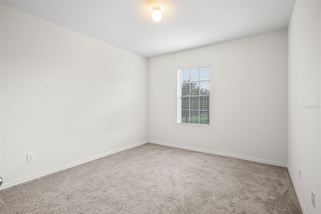 3449 Seneca Club Loop, Unit 24101 Orlando, FL 32808 - Photo 16 of 29 an empty room with a window