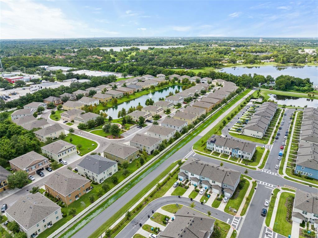 3449 Seneca Club Loop, Unit 24101 Orlando, FL 32808 - Photo 23 of 29 an aerial view of a city with lots of residential buildings