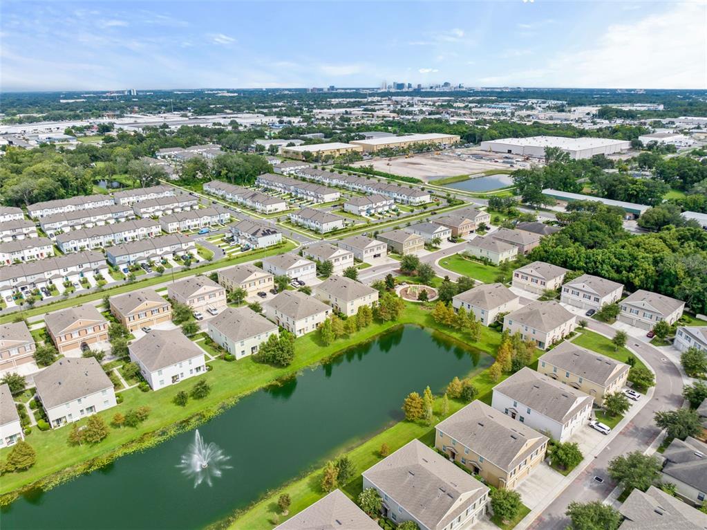 3449 Seneca Club Loop, Unit 24101 Orlando, FL 32808 - Photo 27 of 29 an aerial view of a city with lots of residential buildings