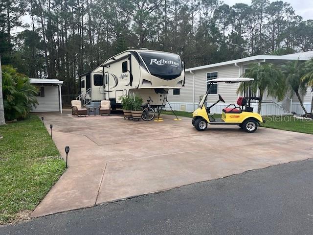 447 Pine Loop Frostproof, FL 33843 - Photo 1 of 20 a view of outdoor space with porch and entertaining space