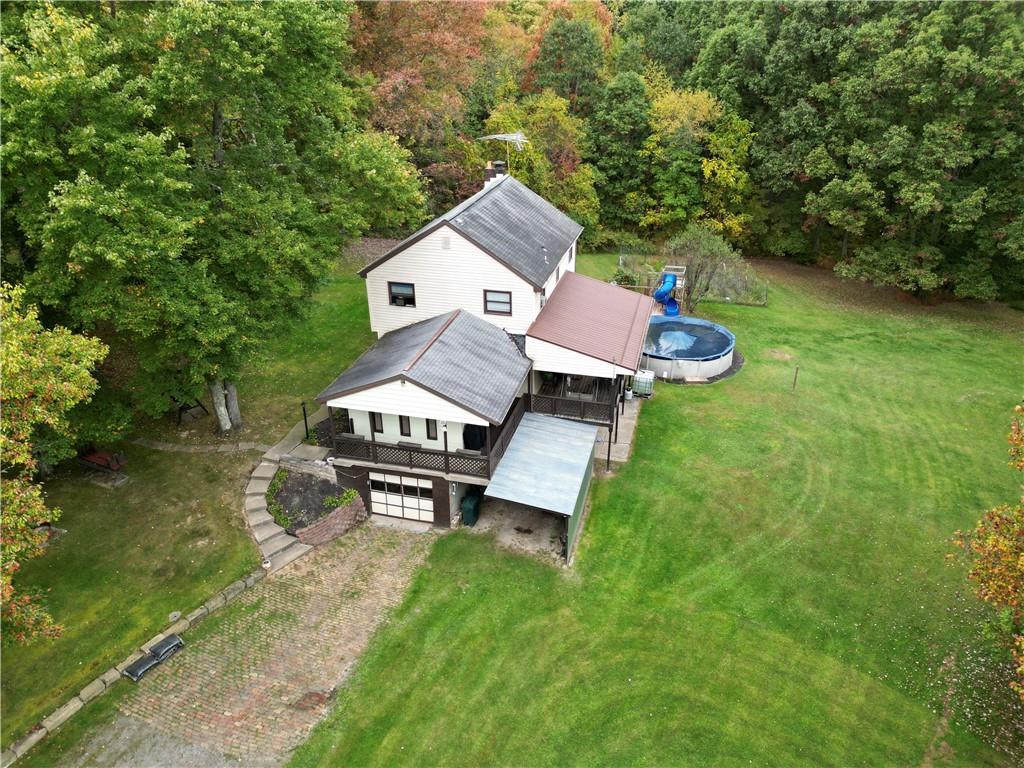 245 Murdocksville Road Clinton, PA 15026 - Photo 21 of 28 an aerial view of a house with garden space and a bench