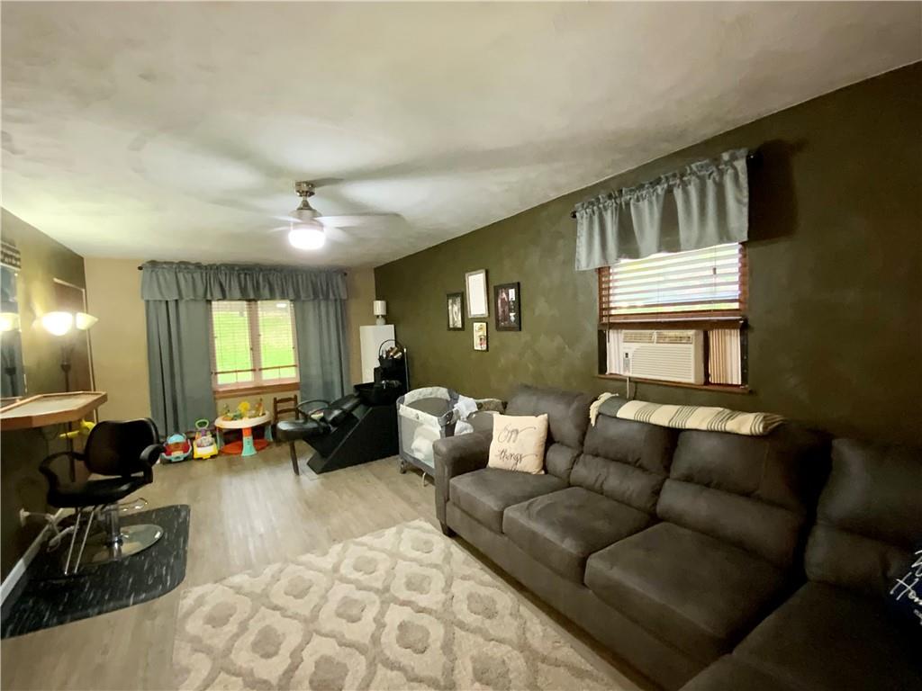 245 Murdocksville Road Clinton, PA 15026 - Photo 8 of 28 a living room with furniture and wooden floor