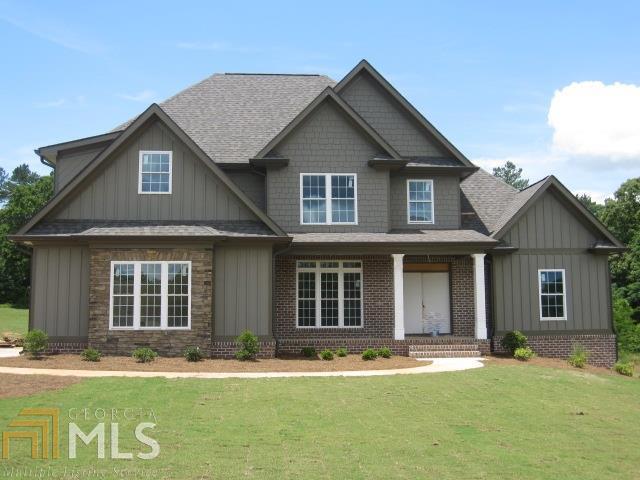 1651 Rambling Rill Drive, Unit 4 Statham, GA 30666 - Photo 1 of 1 a front view of a house with a yard and garage