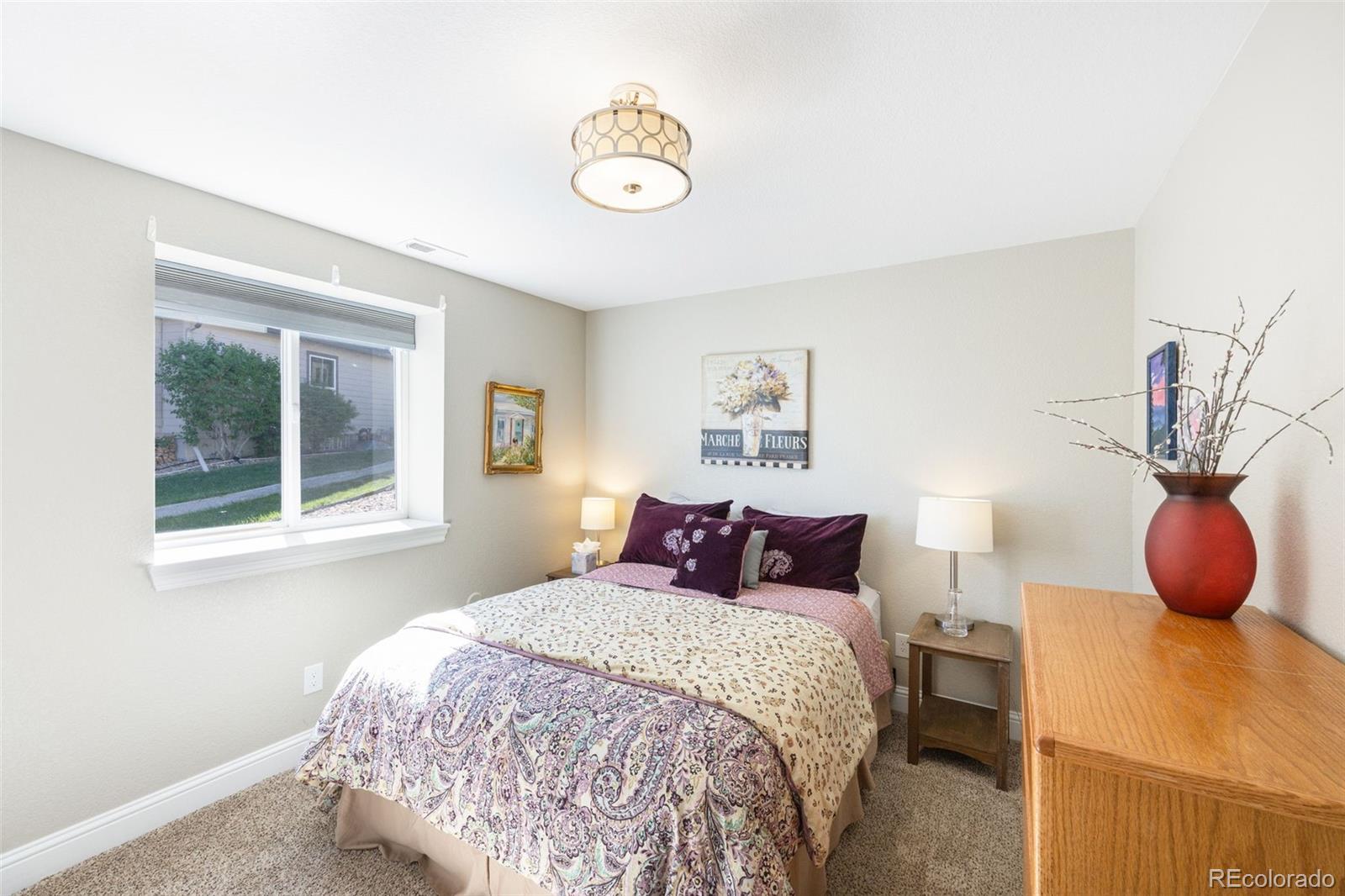 8474 Poppy Street Arvada, CO 80007 - Photo 26 of 40 a bedroom with a bed and window