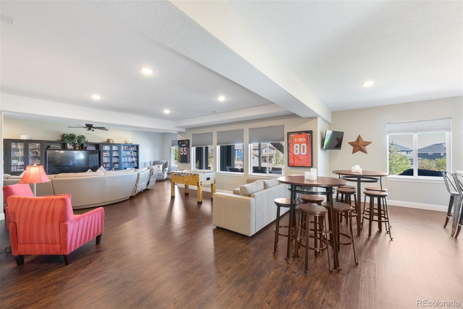 8474 Poppy Street Arvada, CO 80007 - Photo 29 of 40 a living room with furniture and wooden floor