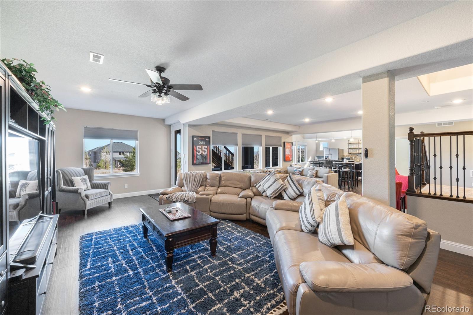 8474 Poppy Street Arvada, CO 80007 - Photo 33 of 40 a living room with furniture fireplace and a large window